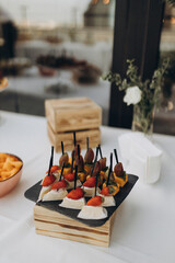 table setting for dinner with fruit on the summer terrace