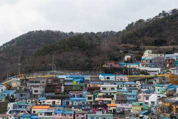 Fototapeta na wymiar Gamcheon Culture Village with colorful houses murals shops and cafe during winter afternoon at Saha-gu , Busan South Korea : 9 February 2023