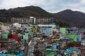 Fototapeta premium Gamcheon Culture Village with colorful houses murals shops and cafe during winter afternoon at Saha-gu , Busan South Korea : 9 February 2023