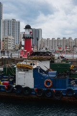 Fototapeta premium Busan Sea Port during winter evening cloudy day at Jung-gu , Busan South Korea : 9 February 2023