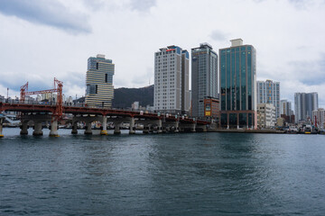 Busan Sea Port  and Yeongdo Bridge during winter evening cloudy day at Jung-gu , Busan  South Korea : 9 February 2023