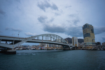 Busan Sea Port city view and Busan bridge during winter evening cloudy day at Jung-gu , Busan  South Korea : 9 February 2023