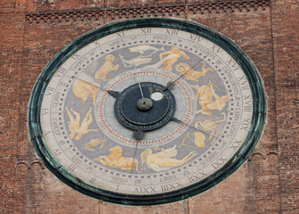 Fototapeta na wymiar Clock on the Medieval Bell Tower of Cremona known as the Torrazzo, Lombardy, Italy.