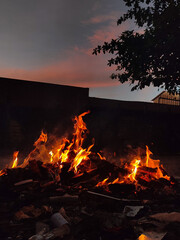 Burning Trash in Evening with Sunset View