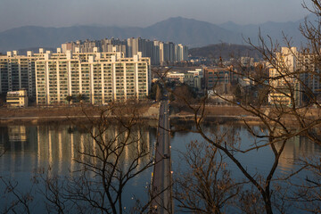 Chuncheon cityscape and panoramic view of Soyang River and buildings during winter evening at Chuncheon , South Korea : 11 February 2023