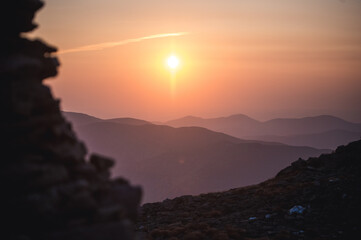 Cairn and mountains in New Hampshire's White Mountains at sunrise