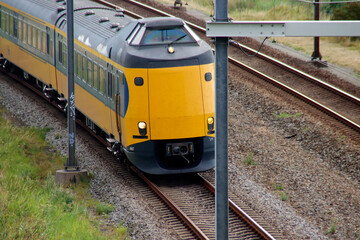 Obraz premium ICM koploper intercity on railroad track in Moordrecht