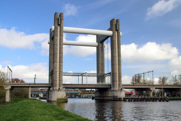 Fototapeta premium vertical lift bridge for trains in Gouda over canal named Gouwe