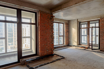 Repair and restoration of apartments. Red brick walls, concrete floors.