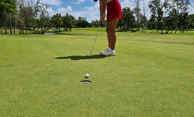 Golfer plays golf on golf course concept