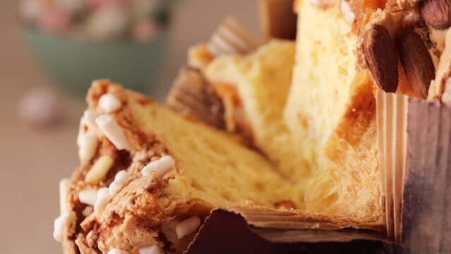 Colomba pasquale-Italian Easter cake, with a big plan. Разрез Easter cake with almonds and orange pee. Traditional Italian pastries