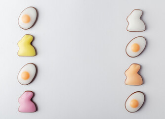 Easter traditional candy chocolate eggs and bunnies on white background. Happy Easter concept, preparation for holiday. Flat lay, top view, copy space, banner or card