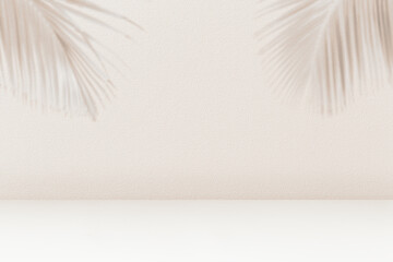 Product placement background with palm leaves shadow on beige cement wall texture.