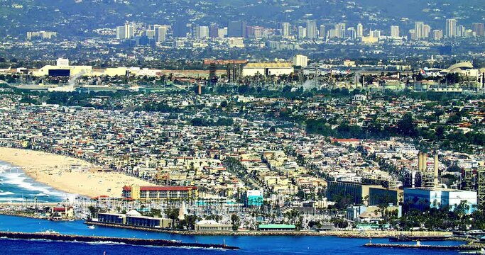 Aerial panorama of Hermosa Beach, Redondo Beach, Manhattan Beach, Pacific Ocean and the airplane taking off from LAX in Los Angeles, California, 4K