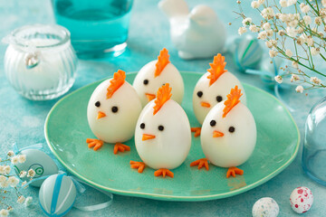 Funny eggs chicks. Easter idea for festive dinner - 587210144