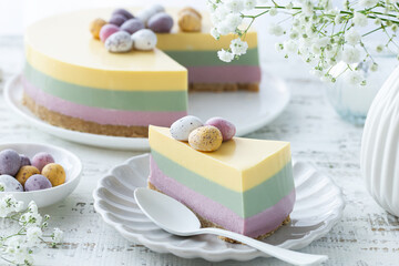 Slice of Easter no baked rainbow cheesecake