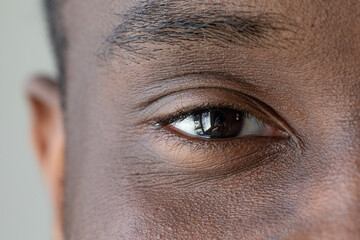 Macro of an African boy's eye with black iris