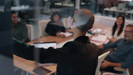 Confident female professional giving a presentation in a meeting, addressing her team on a project and sharing her ideas. Young business woman taking the lead on an office collaboration. - Powered by Adobe