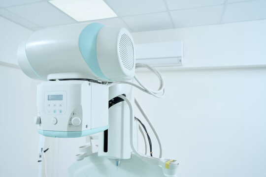 Cropped photo of X-ray room with modern X-ray machine in clinic