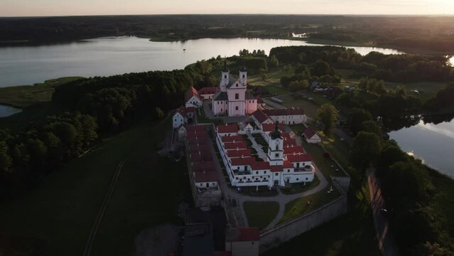 Drone view of Church and monastery at Wigry lake during sunset, Suwalszczyzna, Podlaskie, Poland