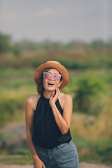 happiness face of asian woman standing outdoor