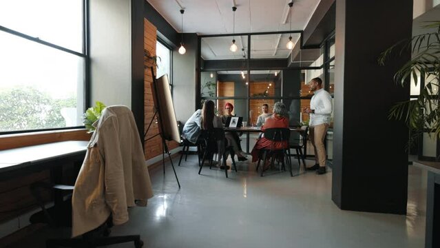 Diverse business team having a meeting in a creative coworking office