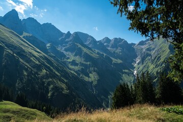 Obraz premium Beautiful view of a mountain with a blue sky in the background