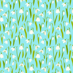 Floral seamless pattern with snowdrops on blue background.