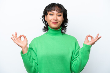 Young Argentinian woman isolated on white background in zen pose