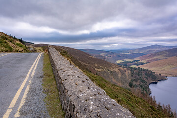 Fototapeta premium dublin, ireland, outdoors, road, landscape, mountain, sky, highway, travel, asphalt, nature, summer, mountains, clouds, way, hill, drive, grass, scenery, journey, trip, view, line, transportation, car