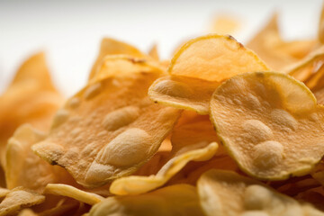 A tantalizing close-up of golden potato chips crispy - Generative AI