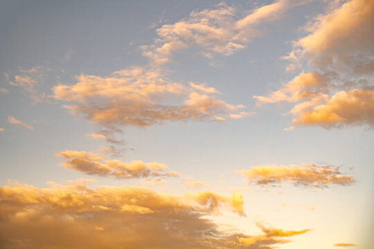 White clouds with yellow sunset light sky