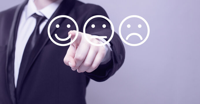 Businessman hand pointing on emoji icons. Communication, technology,  IoT, internet, global, futuristic concept