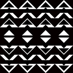 Seamless geometric pattern with black and white triangles on black background