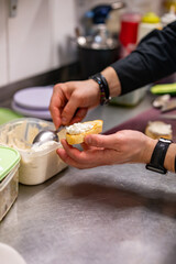 man chef hand cooking tapas with cream cheese on restaurant kitchen