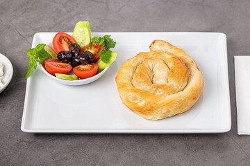 Traditional Turkish pastry made with spinach and cheese wrapped in phyllo. Turkish name gul boregi or gul borek