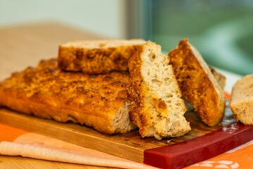 Closeup shot of focaccia bread on a wooden board