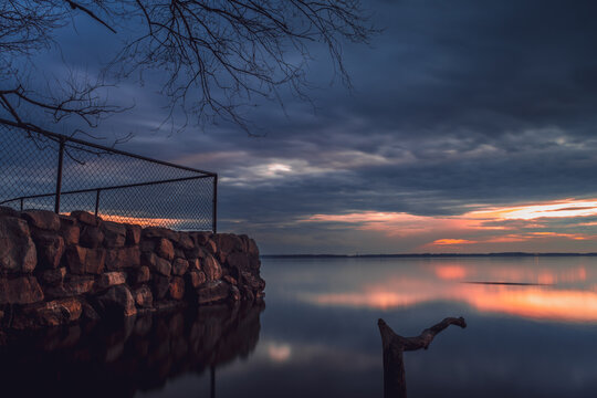 Scenic view of a vibrant sunset at a lake in Ile Perrot in southwestern Quebec, Canada