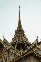 Vertical low-angle shot of the Chakri Maha Prasat Throne Hall castle in Bangkok, Thailand.