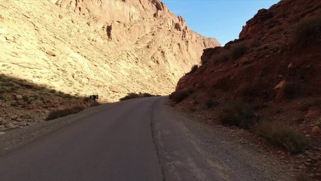 Point of view of a motorcycle driver in a solitary and desertic road.