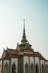Fototapeta na wymiar Vertical shot of the Grand Palace in the streets of Bangkok, Thailand during the day