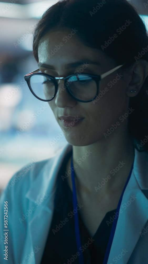 Poster vertical screen: portrait of a professional female specialist using computer at work in research and