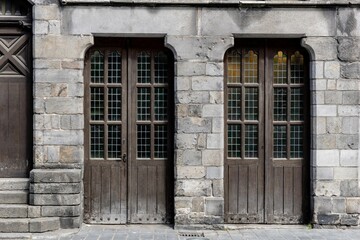 Closeup view of old doors of a brick building