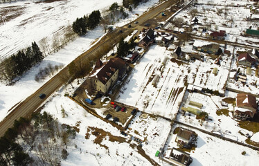 Aerial view of the snowy village. Suburb