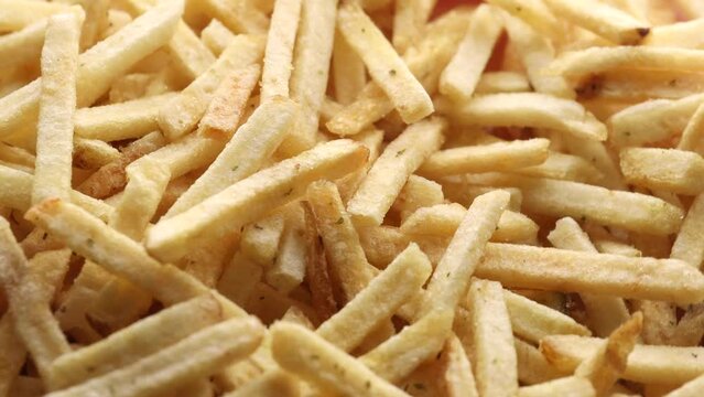 potato straws close up, rotation in circle. potato background Macro. Falling potatoes on a rotating 360 stack