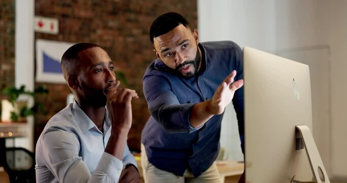 Business people, coach and training employee at night on computer in digital marketing, advertising or finance at the office. Black man working late coaching intern explaining system software on PC