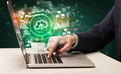 Business hand typing on a modern laptop