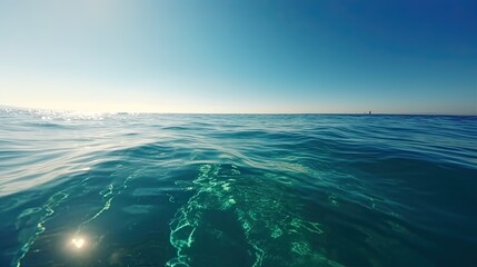 Picture a serene ocean surface on a sunny day, with calm waters. Generative AI