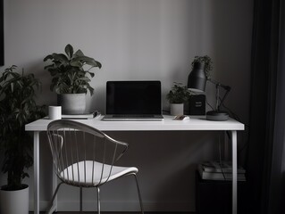 A minimalist and modern desk setup with a laptop and plants