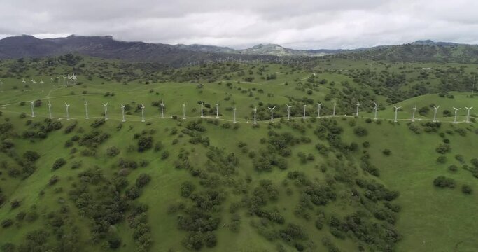 Windmills in Upper Cottonwood Creek Wildlife Area near Los Banos. California. USA. Mountains in Background
